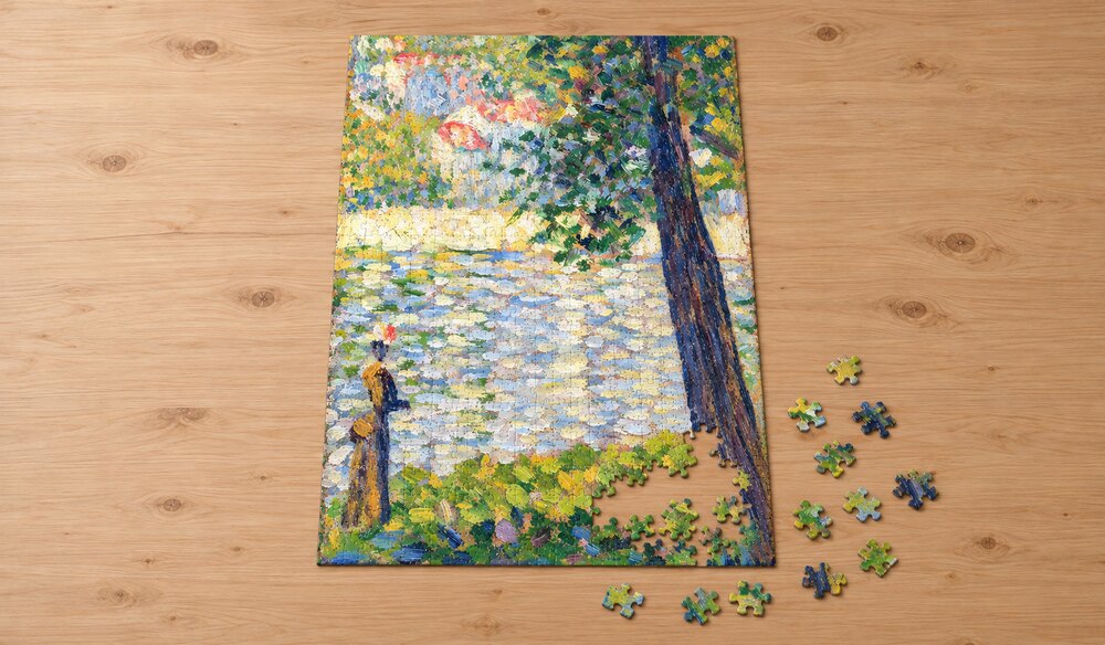 ジョルジュ・スーラ「朝の散歩」を絵柄にした、組み立て途中のジグソーパズルのイメージ