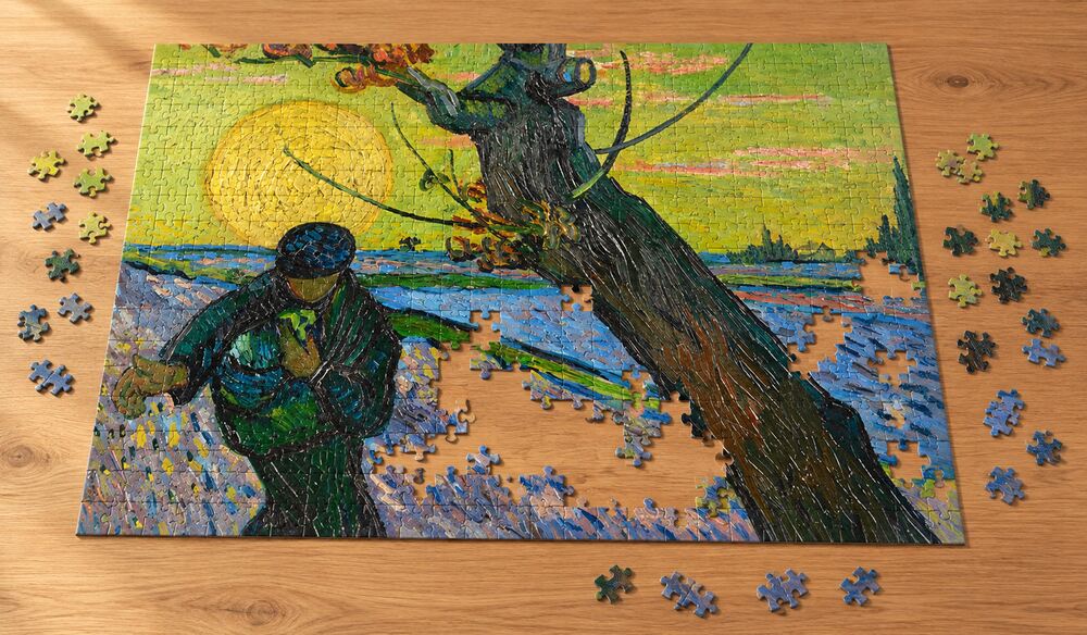 ゴッホ「種まく人」の組み立て途中を表したアートパズルのイメージ。大きな黄色い太陽と、その下の暗い人物を手がかりに楽しむ場面