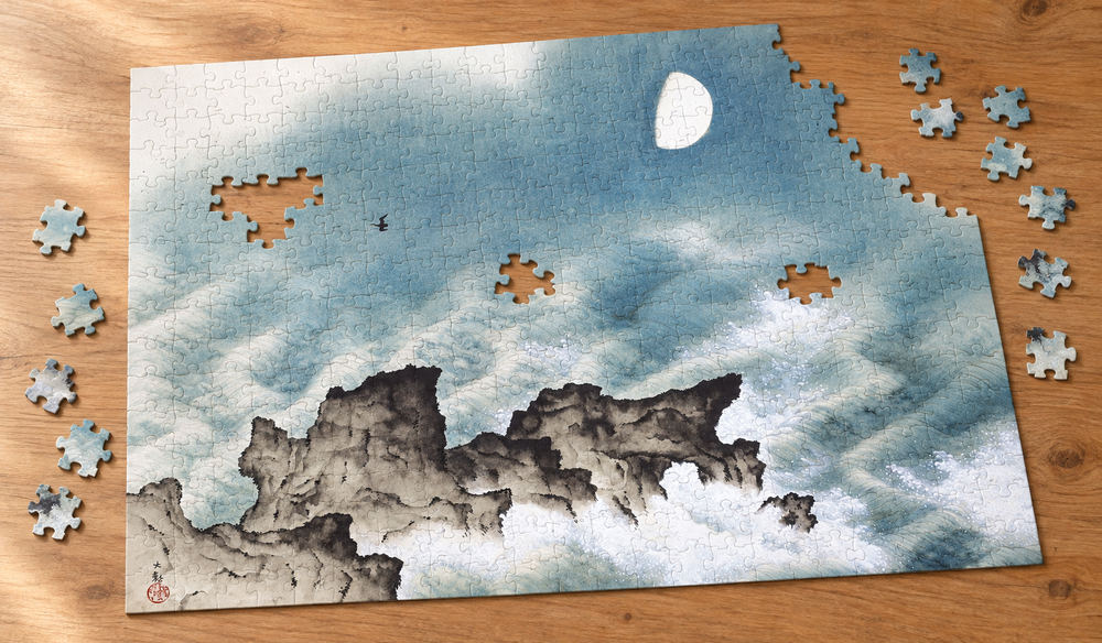 横山大観「海潮四題・夏」を絵柄にした、組み立て途中のジグソーパズルのイメージ