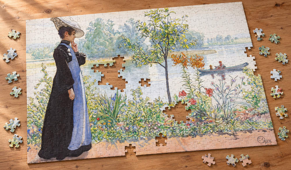 カール・ラーション「夏の終わり（湖畔のカーリン）」を絵柄にした、組み立て途中のジグソーパズルのイメージ