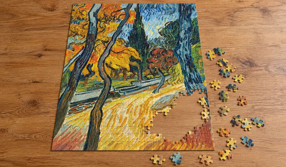 ゴッホ「精神病院の庭の木々」の組み立て途中を表したアートパズルのイメージ