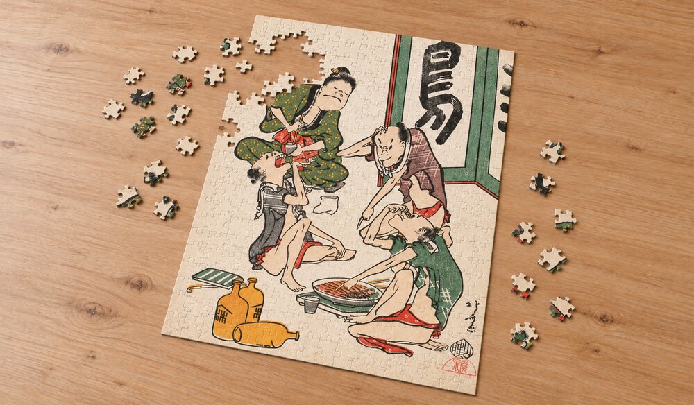 葛飾北斎「鳥羽絵集会 酒盛り」を絵柄にした、組み立て途中のジグソーパズルのイメージ