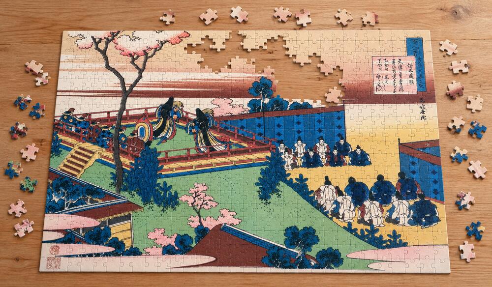 葛飾北斎「百人一首うはかえと起 僧正遍照」を絵柄にした、組み立て途中のジグソーパズルのイメージ