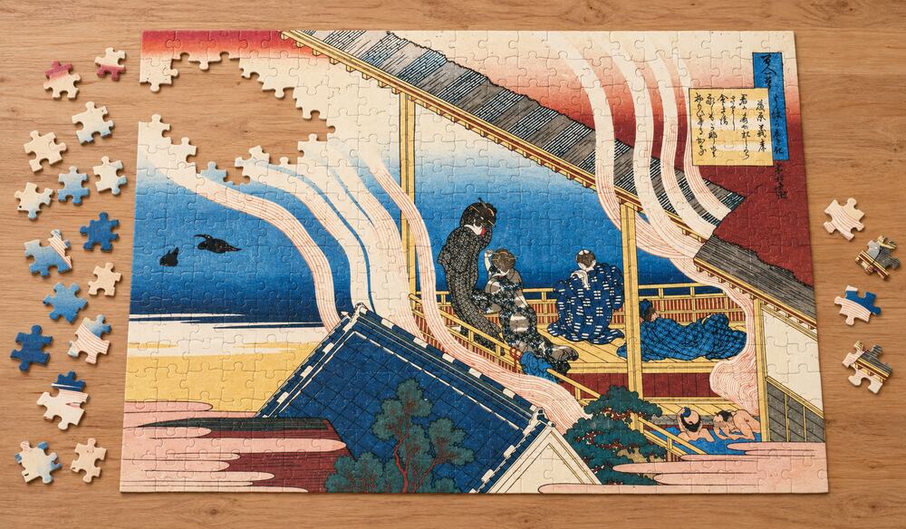 葛飾北斎「百人一首うはかえと起 藤原義孝」を絵柄にした、組み立て途中のジグソーパズルのイメージ
