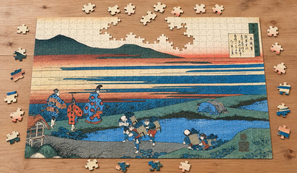 葛飾北斎「百人一首姥かえとき」を絵柄にした、組み立て途中のジグソーパズルのイメージ