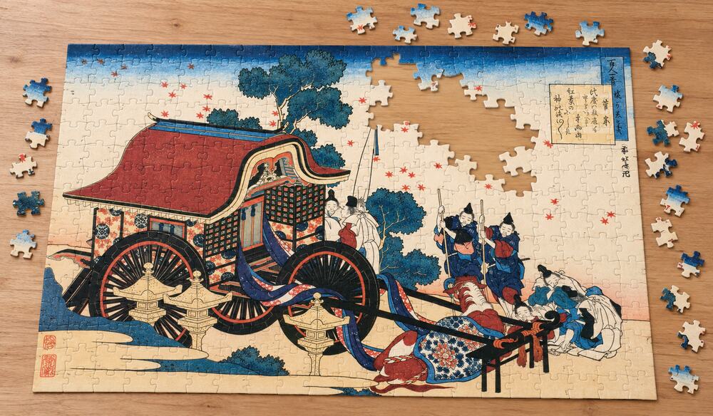 葛飾北斎「百人一首姥か恵と幾 菅家」を絵柄にした、組み立て途中のジグソーパズルのイメージ